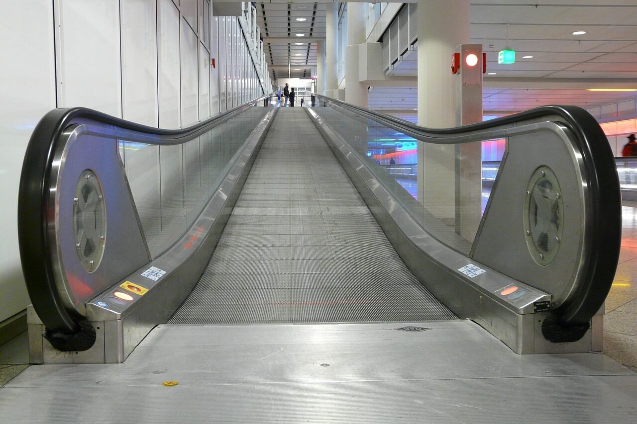 roll band, entry, upwards, high, handrails, moving walkway, roller platform, treadmill, moving sidewalk, rolling pavement, means of rail transport, escalator, metal segments, airport, business trip, move, transport, futuristic, strange, means of transport, facilitate, pavement, moving walkway, treadmill, treadmill, treadmill, treadmill, treadmill, moving sidewalk, facilitate, facilitate, facilitate